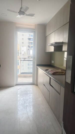 Kitchen in 3 BHK Apartment at Ambience Tiverton, Sector 50 – for Sale