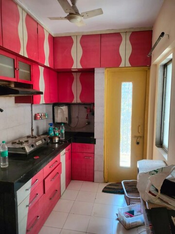Kitchen in 1 BHK Apartment at Parijat Gardens Marigold CHS, Kasarvadavali – for Rent