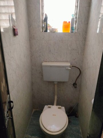 Bathroom in 1 BHK Apartment at Parijat Gardens Marigold CHS, Kasarvadavali – for Rent