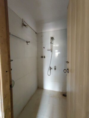 Bathroom in 1 BHK Apartment at Unnati Woods CHS, Kasarvadavali – for Rent