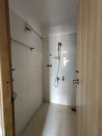 Bathroom in 1 BHK Apartment at Unnati Woods CHS, Kasarvadavali – for Rent