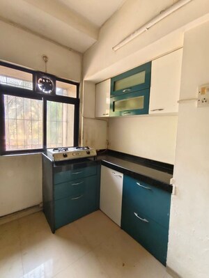Kitchen in 1 BHK Apartment at Unnati Woods CHS, Kasarvadavali – for Rent