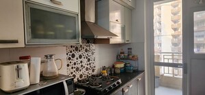 Kitchen in 3 BHK Apartment at Hawelia Valencia Homes, Sector 1 Greater Noida – for Rent