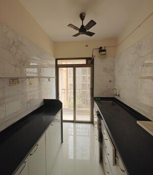 Kitchen in 2 BHK Apartment at Nand Sai Ganesh CHS Sector 50 Seawoods, Seawoods – for Rent