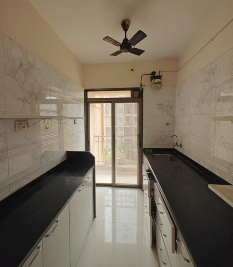 Kitchen, nand-sai-ganesh-chs-sector-50-seawoods 2 Bedroom 1500 Sq.Ft. Apartment In Seawoods Navi Mumbai 10128516