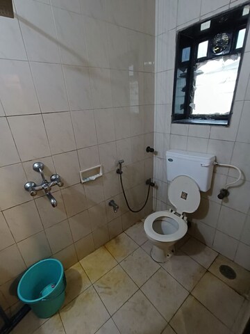 Bathroom in 2 BHK Apartment at Shree Amit Nagar CHS, Andheri West – for Rent