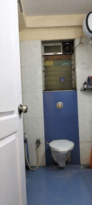 Bathroom in 2.5 BHK Apartment at Ratnagar CHS, Andheri West – for Rent
