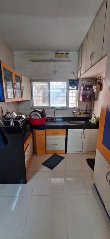Kitchen in 2 BHK Apartment at Dwarkadheesh Residency, Pimple Saudagar – for Rent