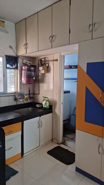 Kitchen in 2 BHK Apartment at Dwarkadheesh Residency, Pimple Saudagar – for Rent
