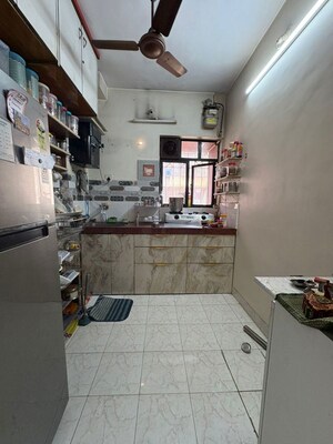 Kitchen in 1 BHK Apartment at Rajnigandha CHS Vasant Vihar, Vasant Vihar – for Sale