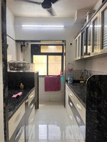 Kitchen in 1 BHK Apartment at Brahmand CHS, Brahmand – for Sale
