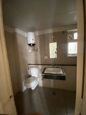 Bathroom in 2 BHK Apartment at Shri Radha Sky Gardens, Sector 16b Greater Noida – for Rent