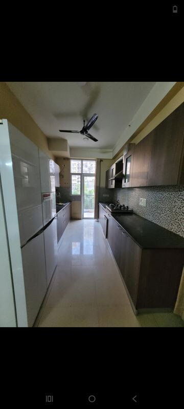 Kitchen in 3.5 BHK Apartment at Gaur Sportswood, Sector 79 – for Rent