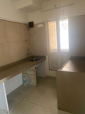 Kitchen in 2 BHK Apartment at Dosti West County, Balkum Pada – for Rent