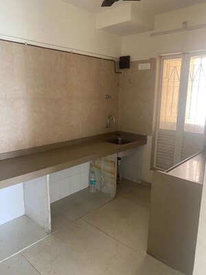 Kitchen in 2 BHK Apartment at Dosti West County, Balkum Pada – for Rent
