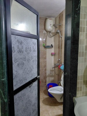 Bathroom in 2 BHK Apartment at Ganga Panchavati CHS, Vasant Vihar – for Rent