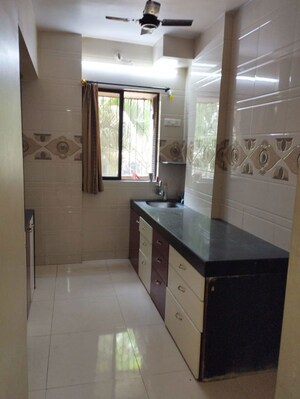 Kitchen in 2 BHK Apartment at Krishna Greenland Park Vastu Federation, Ghodbunder Road – for Sale