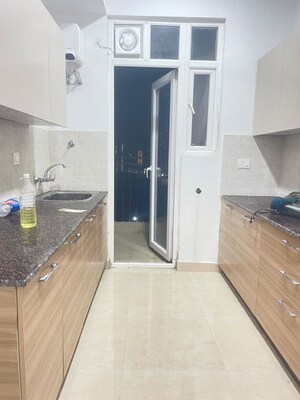 Kitchen in 3 BHK Apartment at ATS Homekraft Pious Hideaways, Sector 150 – for Rent