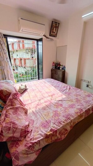 Bedroom in 2 BHK Apartment at Badrivishal Building, Dahisar East – for Sale