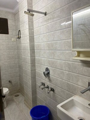 Bathroom in 1.5 BHK Builder Floor at Tagore Garden Extension – for Rent