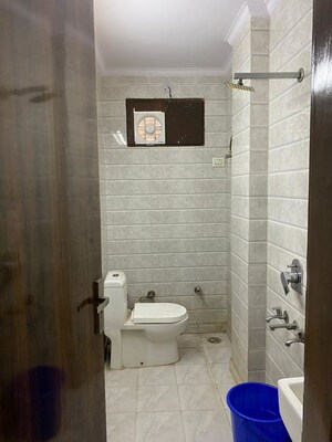 Bathroom in 1.5 BHK Builder Floor at Tagore Garden Extension – for Rent
