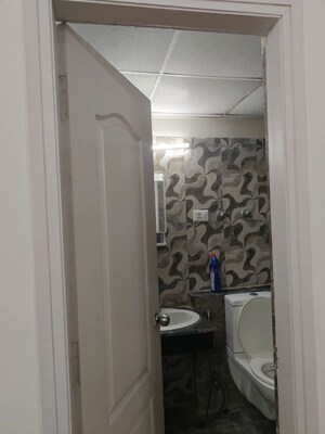 Bathroom in 3 BHK Apartment at Shri Radha Sky Gardens, Sector 16b Greater Noida – for Rent