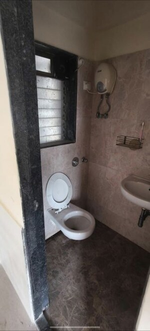 Bathroom in 2 BHK Apartment at Raj Shivganga, Kandivali West – for Rent