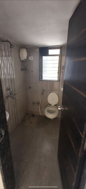 Bathroom in 2 BHK Apartment at Raj Shivganga, Kandivali West – for Rent