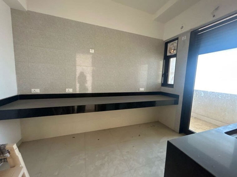 Kitchen, peninsula-celestia-spaces 3 Bedroom 1451 Sq.Ft. Apartment In Parel Mumbai 10137096