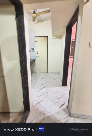 Building Lobby in 1 BHK Apartment at Wadgaon Sheri – for Rent