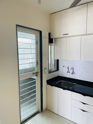 Kitchen in 2 BHK Apartment at Basil Mondale, Mundhwa – for Rent