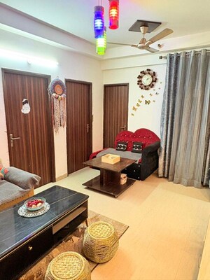 Living Room in 2 BHK Apartment at Mahagun Moderne, Sector 78 – for Rent