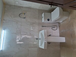 Bathroom in 3.5 BHK Apartment at Aims Golf City, Sector 75 – for Rent