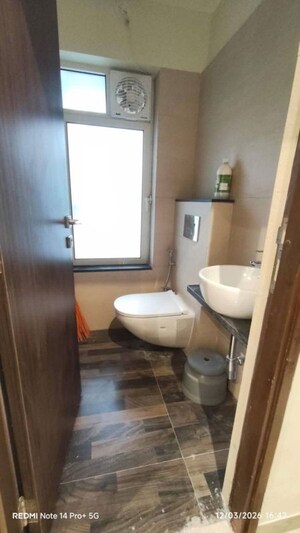 Bathroom in 1 BHK Apartment at Omkar Signet, Malad East – for Rent