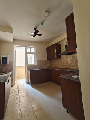 Kitchen in 4 BHK Apartment at Amrapali Heartbeat City, Sector 107 – for Rent