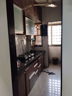 Kitchen in 2 BHK Apartment at Nav Jyotirling CHS, Malad East – for Rent