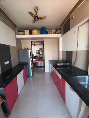 Kitchen in 2 BHK Apartment at Soham Garden, Manpada – for Rent