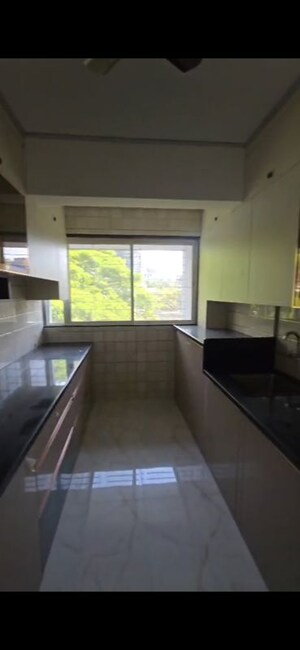 Kitchen in 3 BHK Apartment at Shri Senapati Bapat CHS, Senapati Bapat Road – for Rent