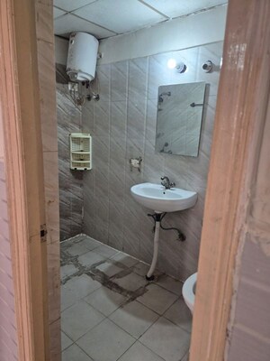 Bathroom in 3 BHK Apartment at Antriksh Golf View, Sector 78 – for Rent