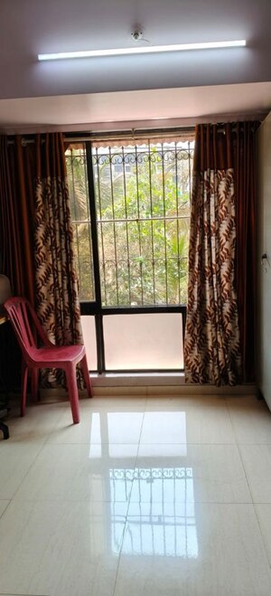 Living Room in 1 BHK Apartment at Safal Park, Nerul – for Sale