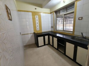 Kitchen in 2 BHK Apartment at Chhadva Avenue CHS, Kopar Khairane – for Rent