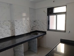 Kitchen in 2 BHK Apartment at Akash Kiran Apartment, Vile Parle East – for Sale