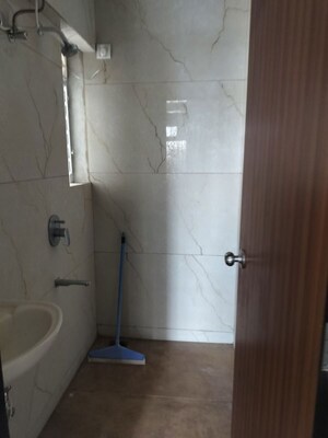 Bathroom in 1 BHK Apartment at Raunak Bliss, Ghodbunder Road – for Rent