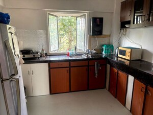 Kitchen in 2 BHK Apartment at Andheri CHS, Andheri West – for Rent
