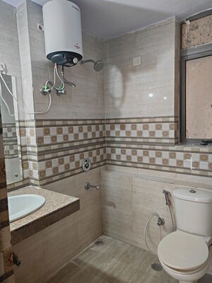 Bathroom in 2 BHK Apartment at Unitech Uniworld Gardens 2, Sector 47 – for Rent
