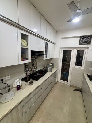 Kitchen in 3.5 BHK Apartment at Aims Golf City, Sector 75 – for Rent