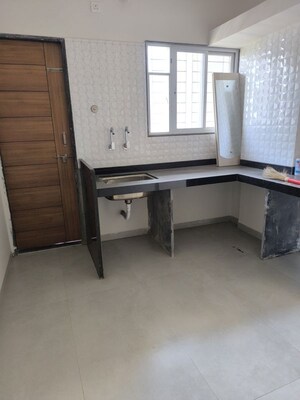 Kitchen in 2 BHK Apartment at 100 Feet Road – for Sale
