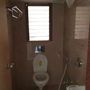 Bathroom in 1 BHK Apartment at The Makwana Om Palace, Malad West – for Rent