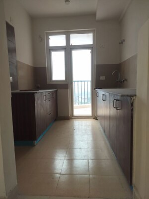 Kitchen in 3 BHK Apartment at Amrapali Heartbeat City, Sector 107 – for Sale