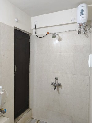 Bathroom in 1 BHK Apartment at Puranik City Reserva, Ghodbunder Road – for Rent